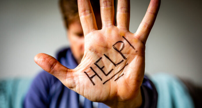 Help Written on Man's Palm